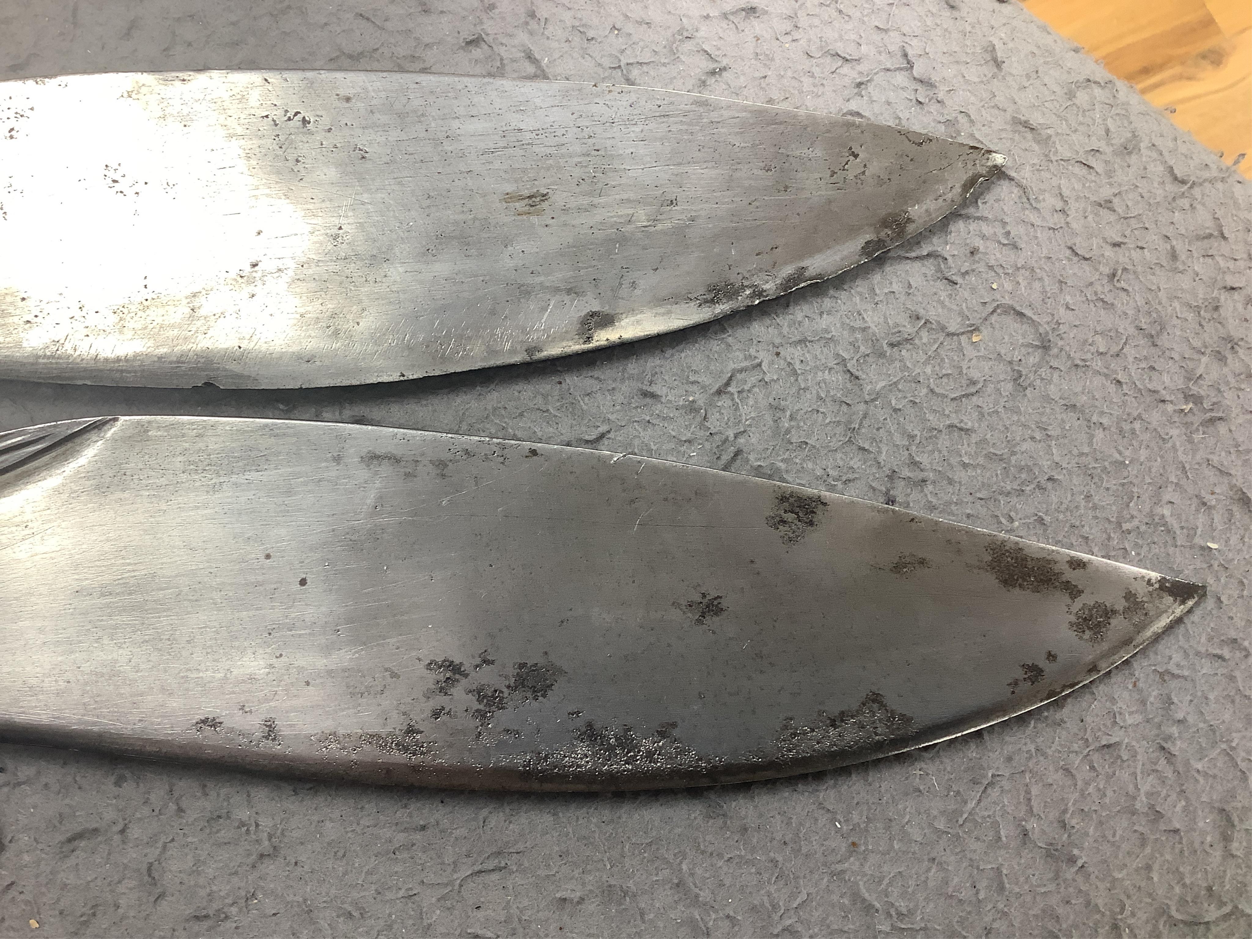 Two military kukri; one with blade stamped with British government ownership mark and issue date February 1916, with wooden handle, no scabbard and another almost identical with board of ordnance mark issued March 1917.